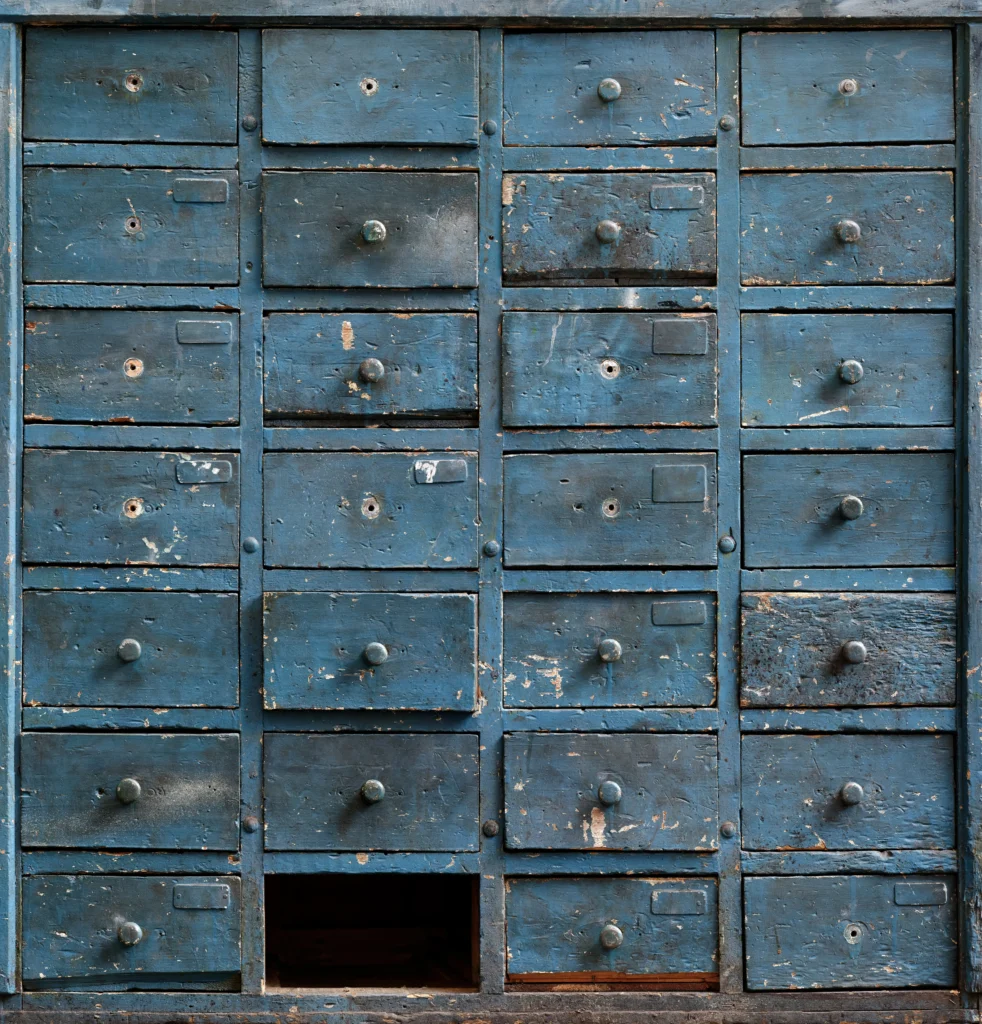 Worn blue wooden drawer cabinet with chipped paint, suited for refurbishment and reuse.